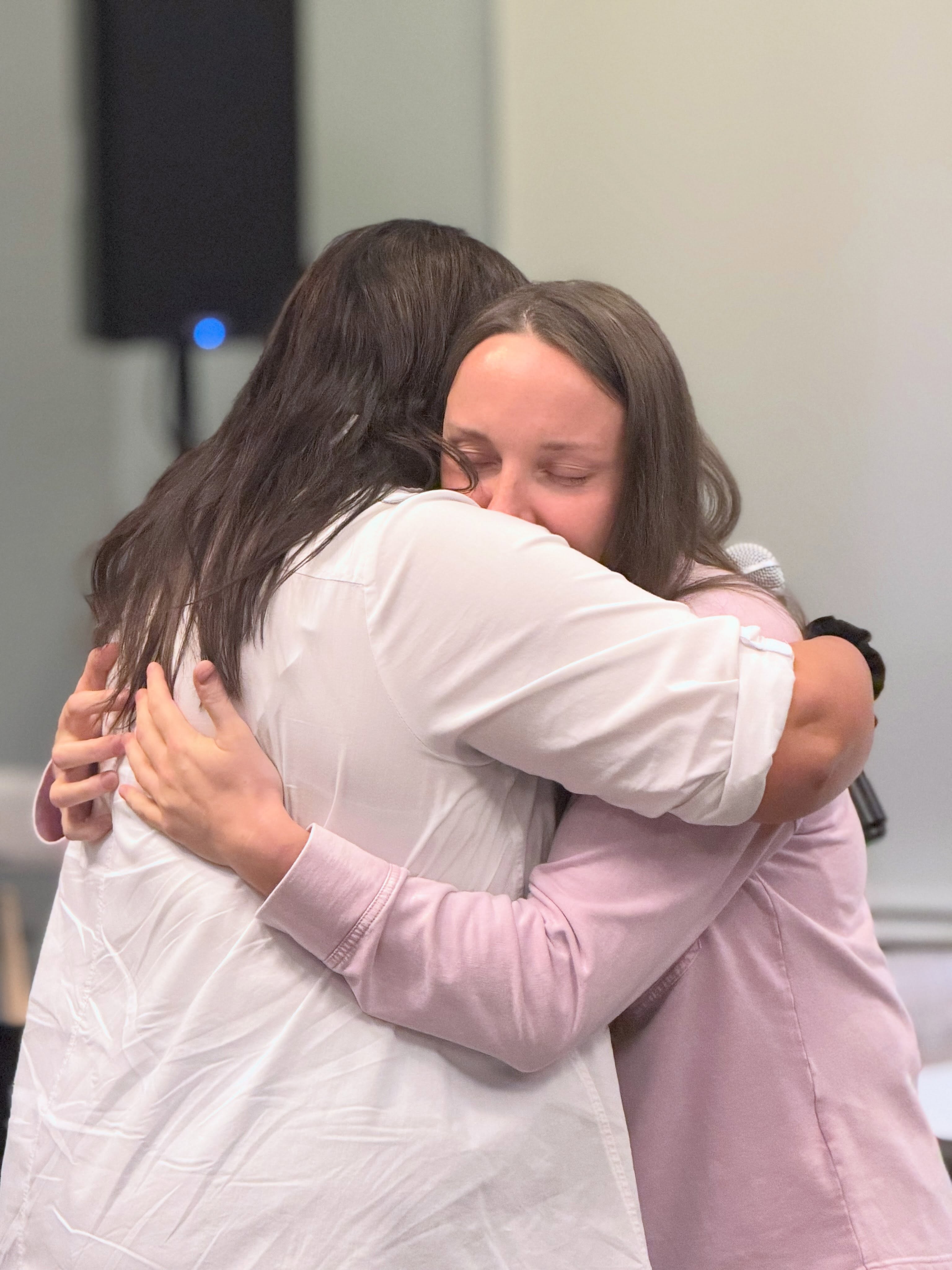 Members of Fellowship Church embracing